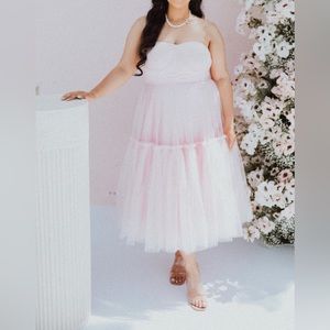 Baby pink Tulle dress only worn once in a size 12 can be altered to your size.